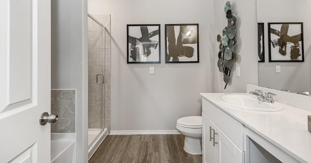 310 Bandit Cove Ct, Crosby, TX 77354 - full bath with a shower stall, toilet, vanity, wood finished floors, and baseboards