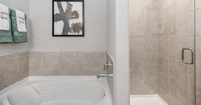 310 Bandit Cove Ct, Crosby, TX 77354 - bathroom with a shower stall and a bath