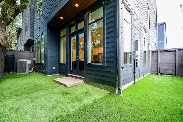 11028 Avenu Malkenu Ave, Houston, TX 77043 - rear view of property with french doors and central AC