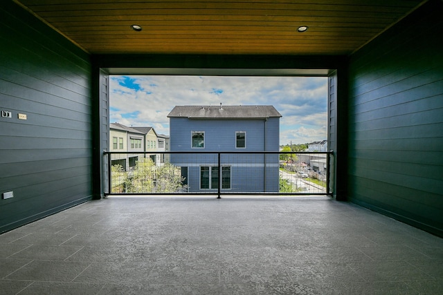 11028 Avenu Malkenu Ave, Houston, TX 77043 - empty room featuring wooden walls, wood ceiling, and plenty of natural light