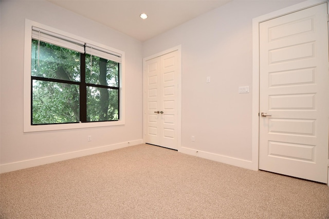 11028 Avenu Malkenu Ave, Houston, TX 77043 - spare room featuring carpet floors, baseboards, and recessed lighting