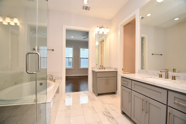 11028 Avenu Malkenu Ave, Houston, TX 77043 - full bathroom with two vanities, a bath, an enclosed shower, recessed lighting, and marble finish floors