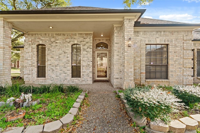 1015 Flagmore Dr, Katy, TX 77450 - property entrance featuring brick siding and a shingled roof