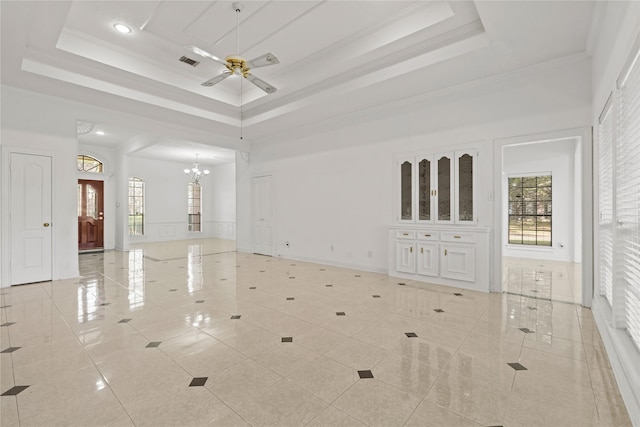 1015 Flagmore Dr, Katy, TX 77450 - spare room featuring ceiling fan, a raised ceiling, a chandelier, a towering ceiling, and baseboards