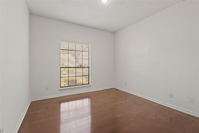 1015 Flagmore Dr, Katy, TX 77450 - unfurnished room with dark wood finished floors and baseboards