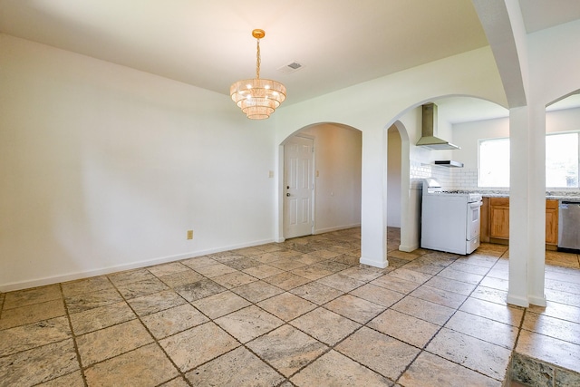 406 Shadylawn St, Shoreacres, TX 77571 - empty room featuring baseboards, stone tile flooring, arched walkways, and a chandelier