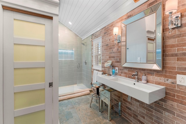 5324 Shady Ln, Eustace, TX 75124 - bathroom with a stall shower, lofted ceiling, a sink, and backsplash