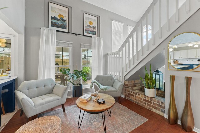 8515 Cold Lake Dr, Houston, TX 77088 - living area featuring a high ceiling, wood finished floors, baseboards, and stairs