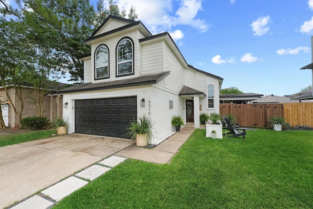 8515 Cold Lake Dr, Houston, TX 77088 - view of front of house featuring an attached garage and driveway