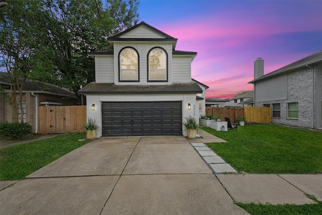 8515 Cold Lake Dr, Houston, TX 77088 - traditional-style home with an attached garage, concrete driveway, and a gate