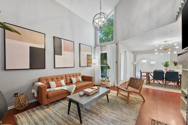 8515 Cold Lake Dr, Houston, TX 77088 - living area with a chandelier, high vaulted ceiling, and hardwood / wood-style flooring