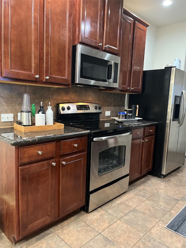 14226 Silver Hollow Ln, Houston, TX 77082 - kitchen featuring stainless steel appliances, decorative backsplash, and dark stone counters