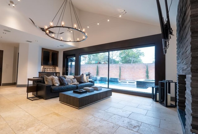 1001 Potomac Dr, Houston, TX 77057 - living area featuring high vaulted ceiling, healthy amount of natural light, and a chandelier