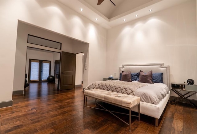 1001 Potomac Dr, Houston, TX 77057 - bedroom with high vaulted ceiling, dark wood finished floors, recessed lighting, baseboards, and french doors