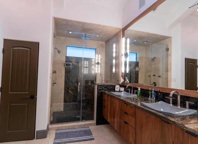 1001 Potomac Dr, Houston, TX 77057 - bathroom featuring double vanity, a stall shower, and tile patterned flooring