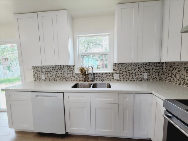 9926 Tangiers Rd, Houston, TX 77041 - kitchen featuring dishwasher, a sink, light countertops, and white cabinets