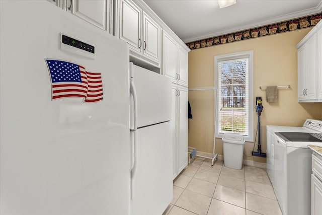 167 Saint Andrews Dr E, Mabank, TX 75156 - kitchen featuring freestanding refrigerator, independent washer and dryer, baseboards, white cabinetry, and light tile patterned floors