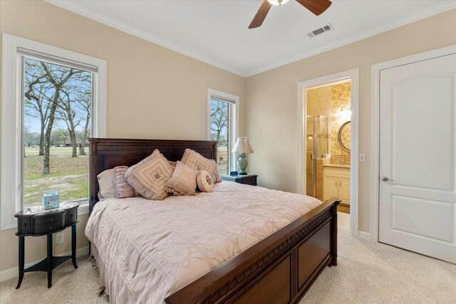 167 Saint Andrews Dr E, Mabank, TX 75156 - bedroom featuring light colored carpet, ornamental molding, baseboards, connected bathroom, and ceiling fan
