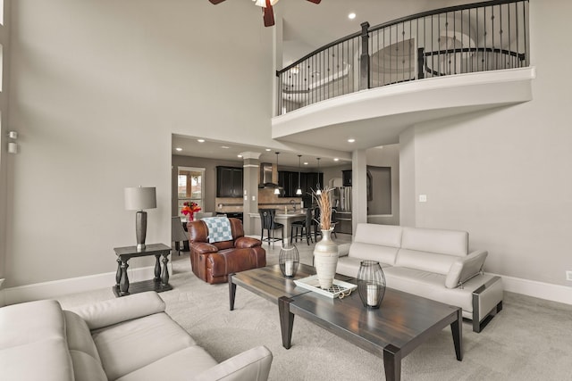 17006 Shannon Lake Ct, Houston, TX 77044 - living room with baseboards, ceiling fan, a high ceiling, light carpet, and recessed lighting