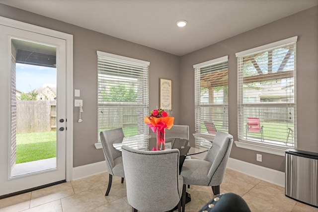 17006 Shannon Lake Ct, Houston, TX 77044 - dining room with healthy amount of natural light, baseboards, light tile patterned floors, and recessed lighting