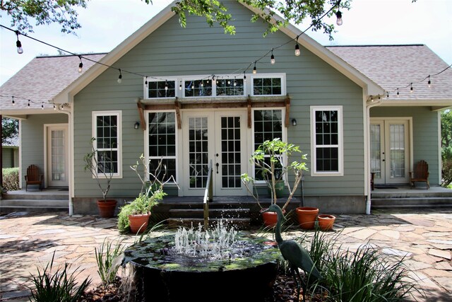 323 E County Road 461b, Brazoria, TX 77422 - rear view of property with french doors, a patio area, and roof with shingles