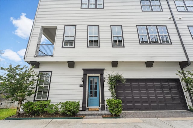 10756 Craighead Dr, Houston, TX 77025 - view of front of house with a garage and decorative driveway