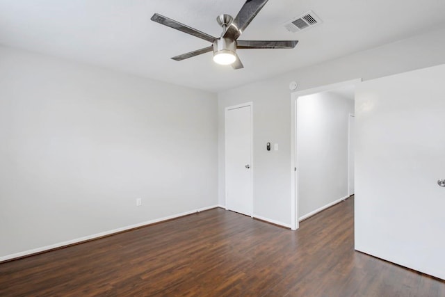 2102 Silver Moon Trl, Crosby, TX 77532 - spare room featuring wood finished floors, ceiling fan, and baseboards