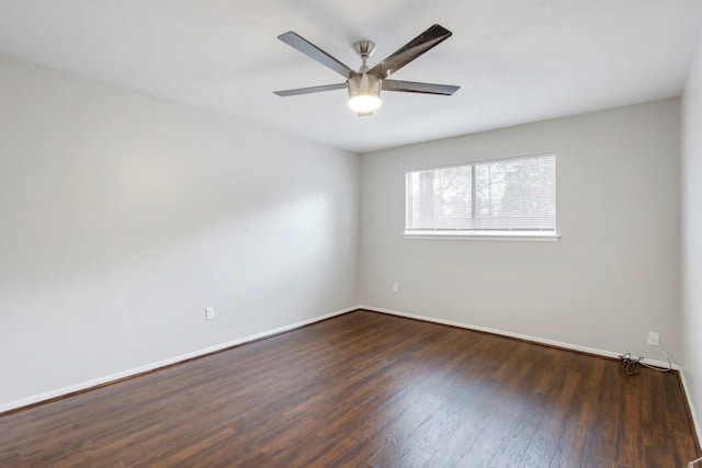 2102 Silver Moon Trl, Crosby, TX 77532 - spare room with wood finished floors, ceiling fan, and baseboards