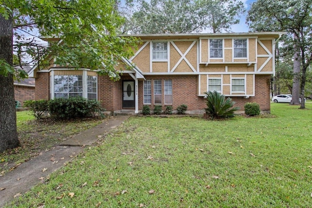 2102 Silver Moon Trl, Crosby, TX 77532 - tudor house with a front yard and brick siding