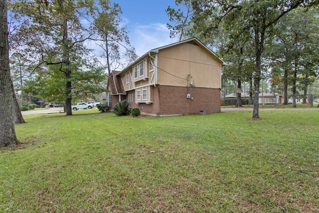 2102 Silver Moon Trl, Crosby, TX 77532 - view of side of property featuring a yard and brick siding