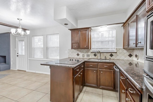 2102 Silver Moon Trl, Crosby, TX 77532 - kitchen featuring a sink, stainless steel appliances, a peninsula, backsplash, and light tile patterned floors