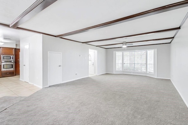 2102 Silver Moon Trl, Crosby, TX 77532 - empty room featuring light carpet, baseboards, and beam ceiling