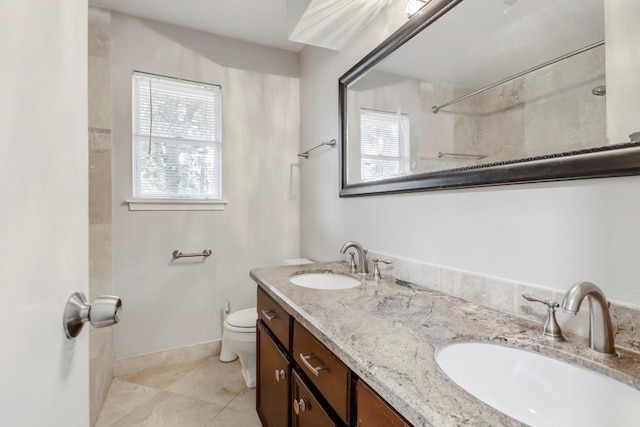 2102 Silver Moon Trl, Crosby, TX 77532 - bathroom featuring plenty of natural light, toilet, tile patterned floors, and double vanity