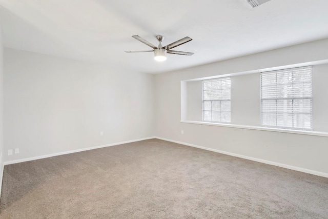2102 Silver Moon Trl, Crosby, TX 77532 - spare room with ceiling fan, carpet, and baseboards