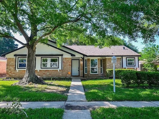1919 Fall Meadow Dr, Missouri City, TX 77459 - view of front of property with a front yard and brick siding