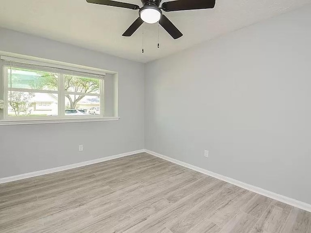 1919 Fall Meadow Dr, Missouri City, TX 77459 - empty room featuring light wood finished floors, baseboards, and a ceiling fan