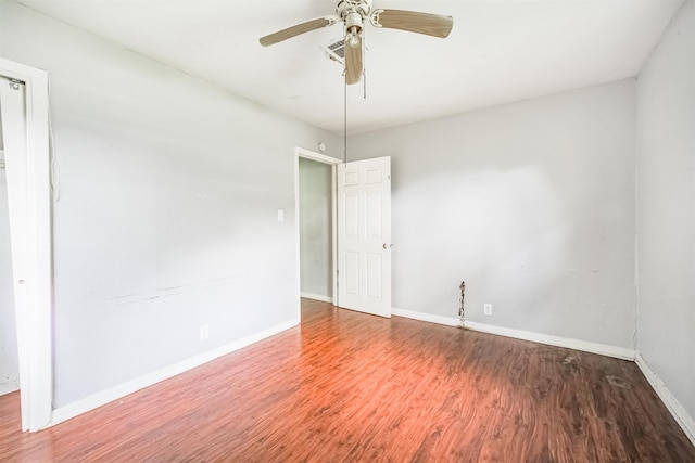 606 Roosevelt St, La Marque, TX 77568 - empty room featuring wood finished floors, baseboards, and ceiling fan