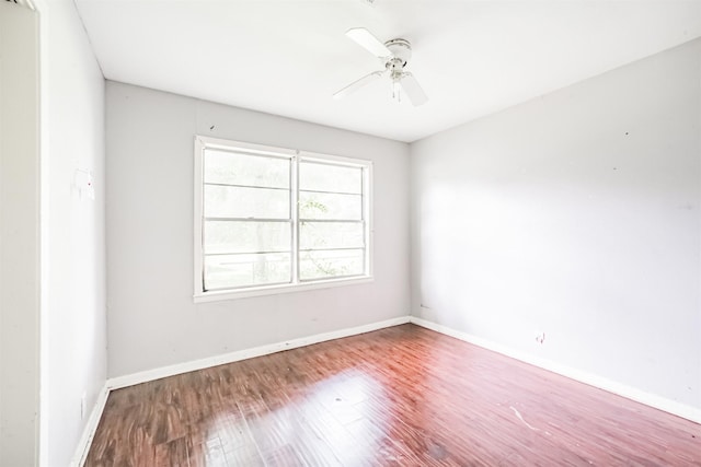 606 Roosevelt St, La Marque, TX 77568 - spare room with wood finished floors, baseboards, and a ceiling fan