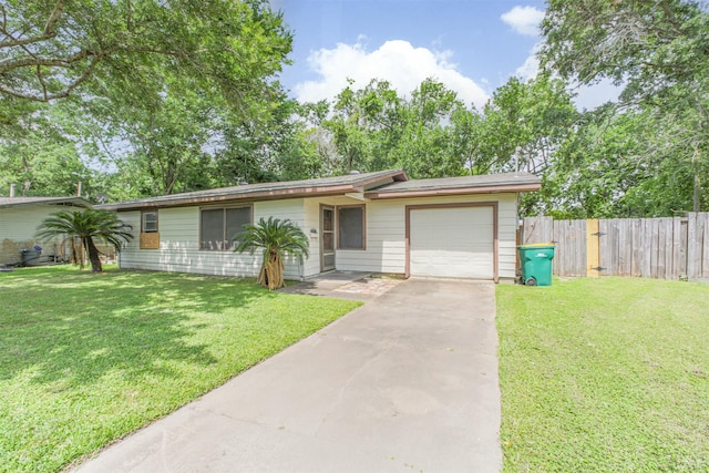 606 Roosevelt St, La Marque, TX 77568 - ranch-style home featuring an attached garage and driveway
