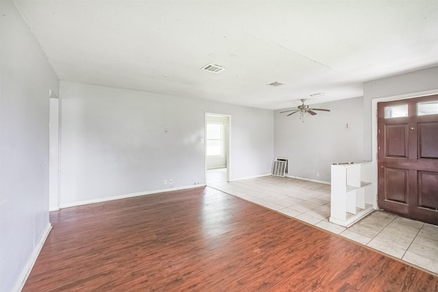 606 Roosevelt St, La Marque, TX 77568 - foyer entrance with light wood-style floors, ceiling fan, and baseboards