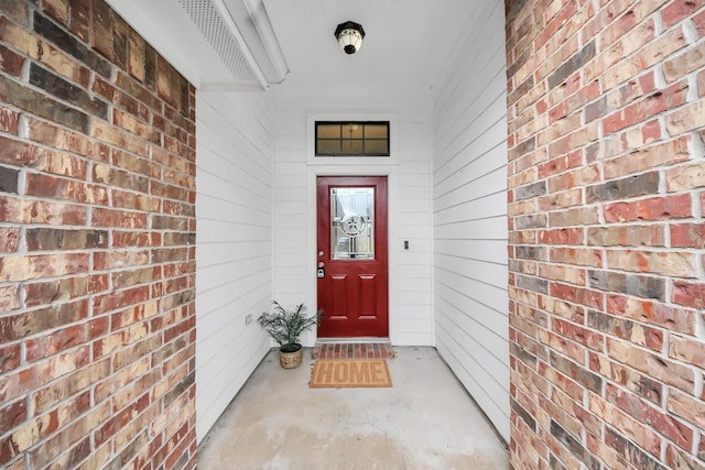 105 Meadowlark Ct, Richwood, TX 77566 - view of exterior entry featuring brick siding