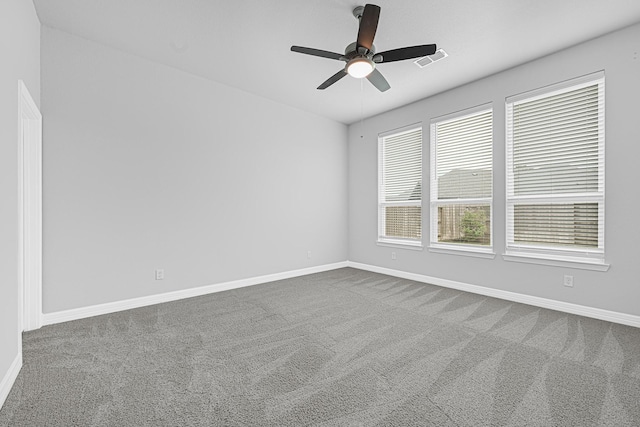 24634 Carleton Lake Ln, Tomball, TX 77375 - unfurnished room with ceiling fan, dark carpet, and baseboards