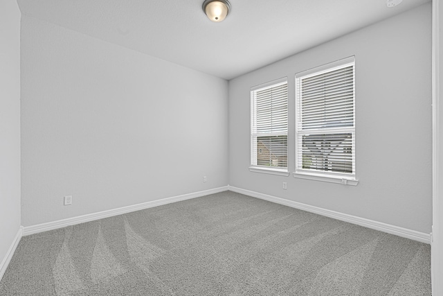 24634 Carleton Lake Ln, Tomball, TX 77375 - empty room with carpet flooring and baseboards