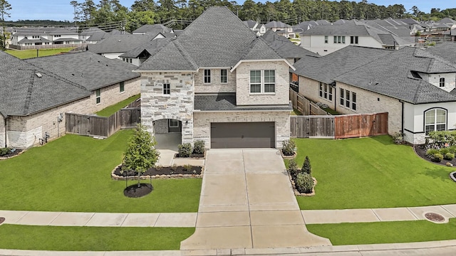 24634 Carleton Lake Ln, Tomball, TX 77375 - french country style house featuring a residential view, driveway, an attached garage, and brick siding