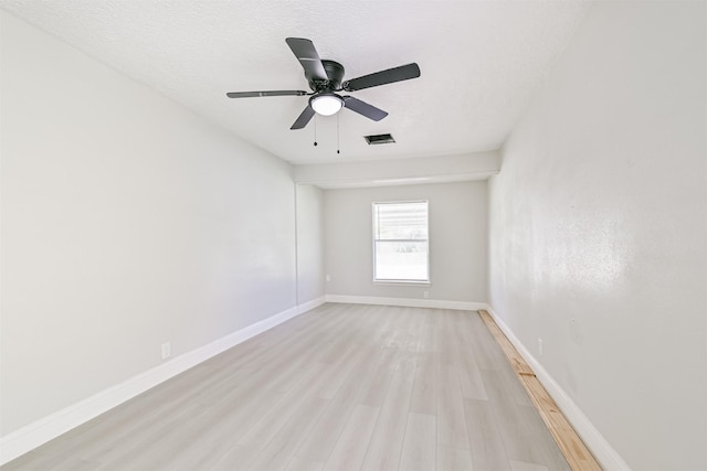 5007 Northridge Dr, Houston, TX 77033 - spare room featuring light wood-style floors, baseboards, and ceiling fan