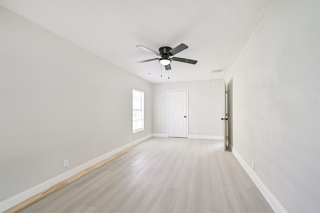 5007 Northridge Dr, Houston, TX 77033 - empty room featuring ceiling fan, light wood-style floors, and baseboards