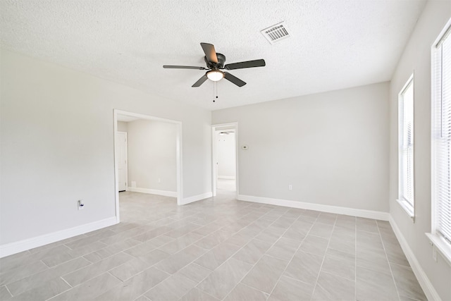 5007 Northridge Dr, Houston, TX 77033 - unfurnished room with a ceiling fan, a textured ceiling, and baseboards