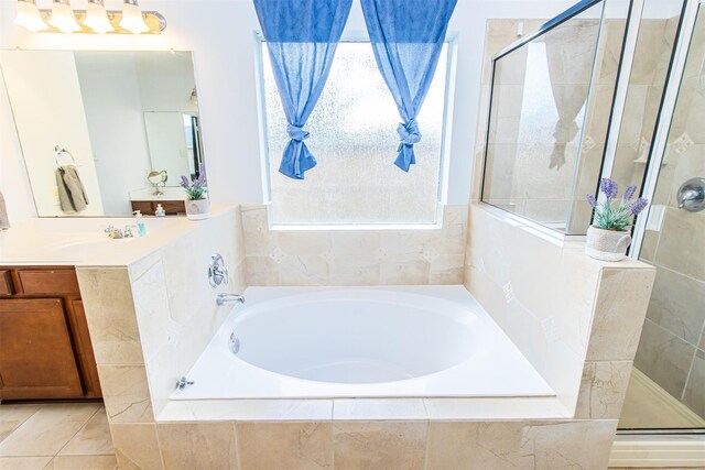 15102 Dry Ridge Ct, Humble, TX 77346 - bathroom with a shower stall, a garden tub, and vanity