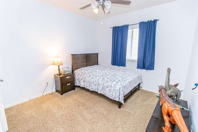 15102 Dry Ridge Ct, Humble, TX 77346 - bedroom with baseboards, carpet floors, and a ceiling fan