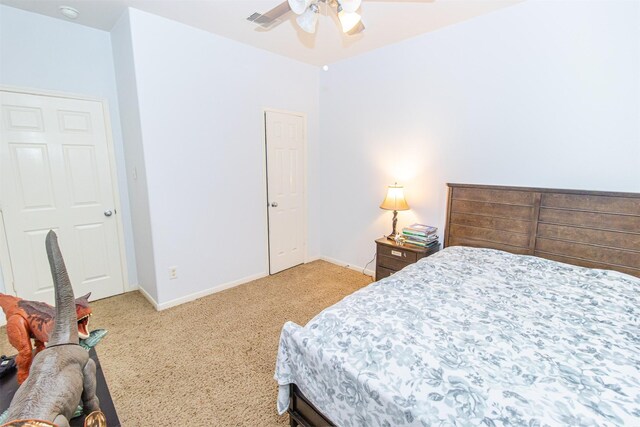 15102 Dry Ridge Ct, Humble, TX 77346 - bedroom featuring light colored carpet, baseboards, and ceiling fan
